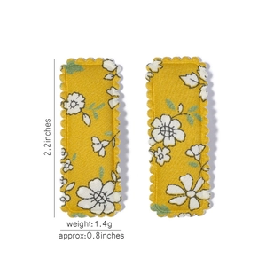 Floral embroidered rectangle hair clips in mustard yellow with scalloped edges