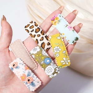 Set of six embroidered fabric BB hair clips with leopard and floral patterns for women