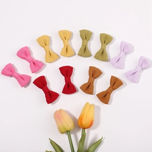 Set of 11 colorful 2-inch cotton linen bow hair clips for girls in various pastel colors