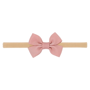 Pink ribbed bow headband for babies on a nude high-elastic nylon band with a clean white background