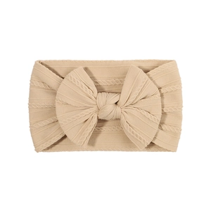 Soft nylon knit baby headband with oversized bow in beige, high elasticity hair accessory