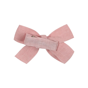 Pink fabric hair bow with soft texture and matching lined clip for babies and girls