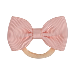 Close-up detail of light pink grosgrain ribbon bow and high-elastic orange hair tie