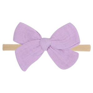 Detailed texture of lavender cotton bow headband with ultra-soft nylon elastic band