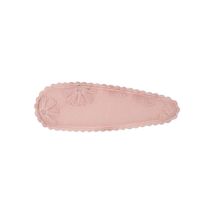 Close-up of pink fabric BB hair clip featuring delicate daisy embroidery and wavy edges