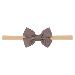 Close-up of handmade dark brown grosgrain ribbon bow on highly elastic infant headband