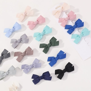 16-piece soft cotton linen bow hair clip set for infants in various macaron colors
