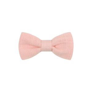 Detail shot of a pink linen fabric bow hair clip featuring a textured matte finish
