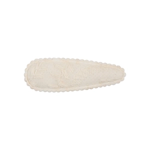 Detailed close-up of cream fabric BB clip with floral embroidery and scallop edges