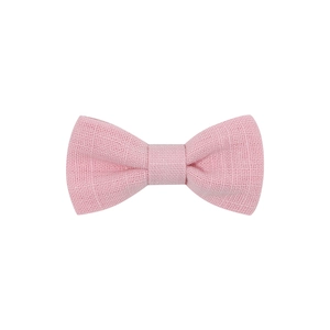 Detail shot of a pink linen bow hair clip showing textured cross-weave fabric