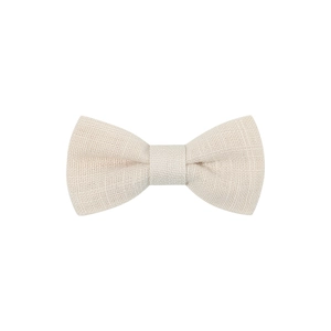Detail shot of beige linen fabric texture on a handmade toddler bow hair clip