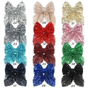 Détail de 12 nœuds à cheveux à paillettes en plusieurs couleurs avec numéros de référence