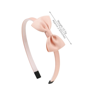 Pink ribbed bow headband for girls with comfortable protective tips for princess hair styling