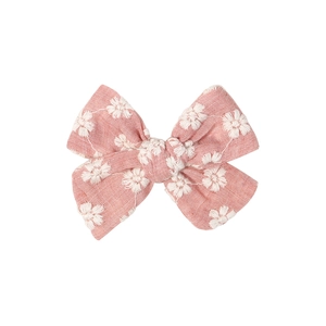 Pink fabric bow hair clip for girls with white daisy embroidery on white background