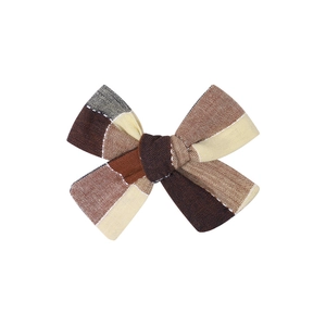 Handmade plaid bow hair clip for children featuring brown and beige checkered fabric patterns