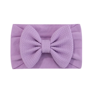 Bandeau bébé violet en nylon doux avec un grand nœud en jacquard texturé pour nourrissons
