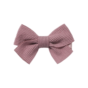 Detail of dusty rose corduroy striped bow hair clip with fabric wrapped edge for girls
