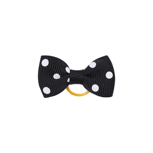 Détail d'un chouchou à nœud à pois avec ruban gros-grain et élastique jaune durable