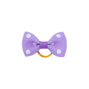 Close-up of purple polka dot bow hair tie with ribbed texture and yellow elastic band