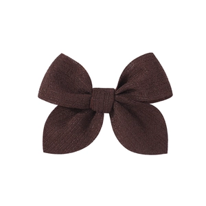 Detailed view of the 3.5-inch chocolate brown fabric bow hairpin with a subtle glitter finish