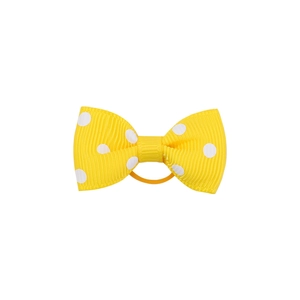 Detail of yellow polka dot ribbon bow hair tie with elastic band for girls