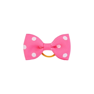 Détail de l'élastique à cheveux rose à pois avec nœud et ruban gros-grain enfant