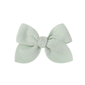 Handmade 3.5 inch mint green fabric bow hair clip for girls on white background