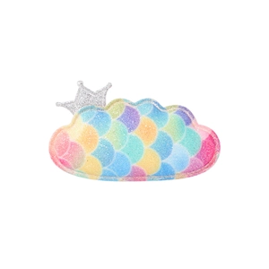 Detail of a glittery cloud hair clip with rainbow scale texture and silver crown
