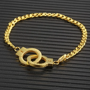 Hip hop gold titanium steel bracelet featuring engraved handcuffs on a black background