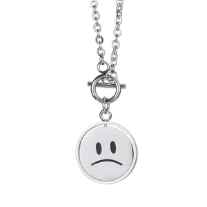 Minimalist silver stainless steel necklace with spinning sad face pendant and OT toggle clasp