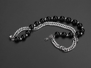 Detail of hip hop double-layer pearl and titanium steel adjustable bracelet showing metal chain