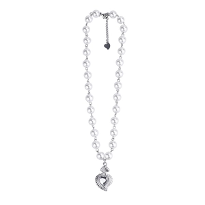 Elegant pearl heart pendant necklace featuring a silver metallic charm with clear crystal