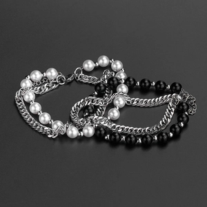 Hip hop layered titanium steel bracelet featuring white pearls and black beads on dark background