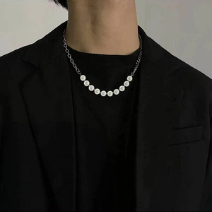 Minimalist pearl stitching titanium steel necklace on model with black clothing