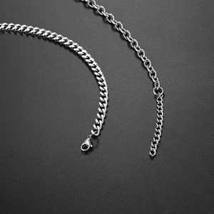 Detail of silver stainless steel Cuban chain necklace with lobster clasp and extender