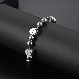 Hip hop titanium steel beaded bracelet featuring melting ghost smile charms with blue stones
