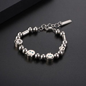 Polished stainless steel bead bracelet with ghost smiley face charms and blue crystal accents