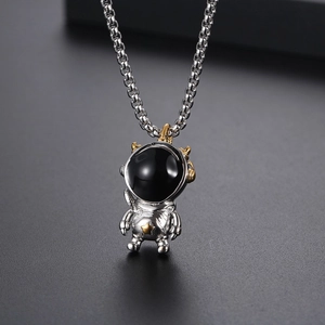 Hip-hop astronaut pendant necklace with silver finish and gold star detail on box chain
