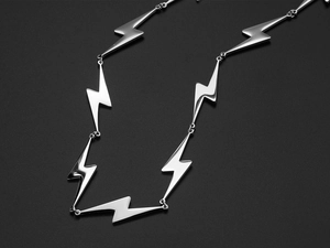 Detailed view of lightning bolt link necklace crafted in high polished stainless steel