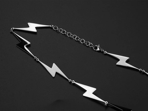 Detail of lightning bolt link necklace with polished finish and lobster clasp closure