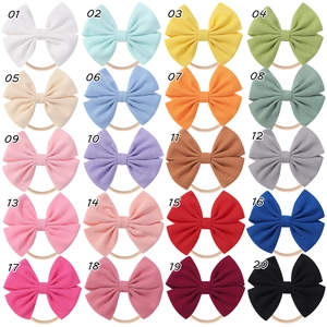 Detailed view of 20 colors waffle fabric bow headbands with soft nylon bands for babies