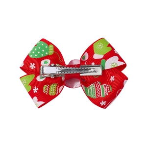 Christmas bow hair clip with red festive glove pattern and silver metal alligator clip