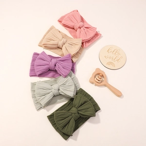 Five-pack baby nylon bow headbands in soft ribbed fabric and assorted pastel colors