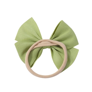 Soft light green bow nylon headband for infants with rib knit texture and seamless design