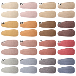Detailed grid of 16 colors of fabric-covered teardrop BB clips with linen texture