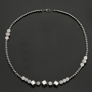 Hip hop stainless steel beaded necklace with silver dice pendants on black background