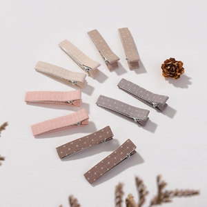 Detailed set of floral cotton linen hair clips for girls in earth tones with dried flowers