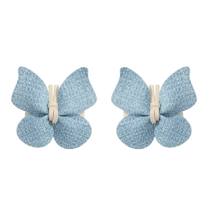 Vue détaillée de barrettes papillon en denim bleu faites main avec nœuds blancs