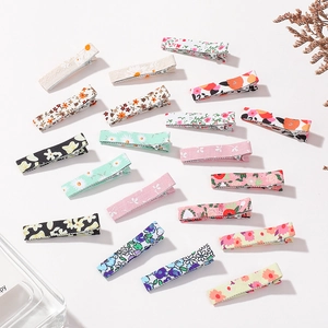 Set of 18 floral cotton hair clips for girls featuring assorted patterns on white background