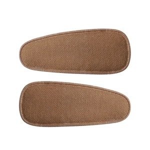 Detail of a pair of brown linen fabric drop-shaped BB hair clips with woven texture